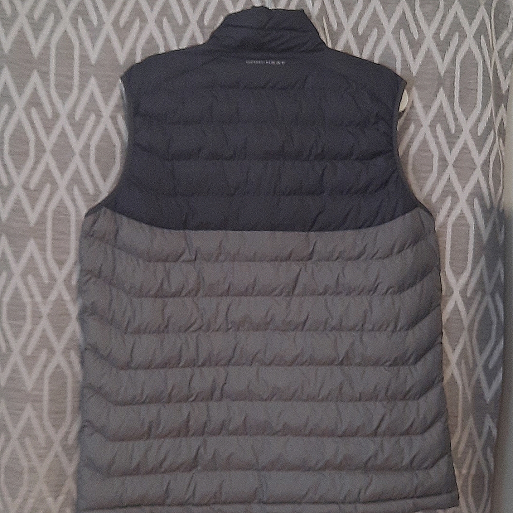 The vest  brand is Columbia, size large for men, color gray.